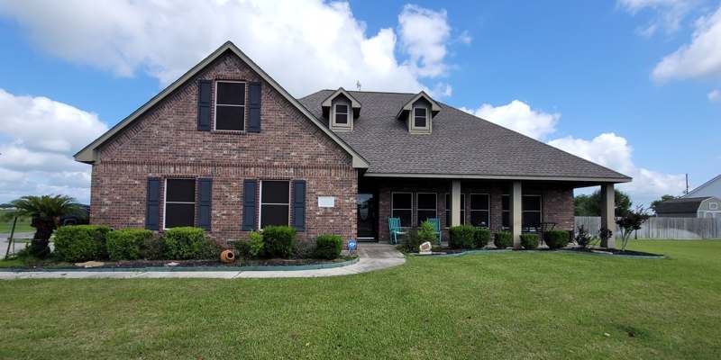 Brick home with new shingle roof in the Houston area