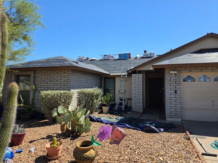 Roof during installation with new underlayment and GAF materials staged